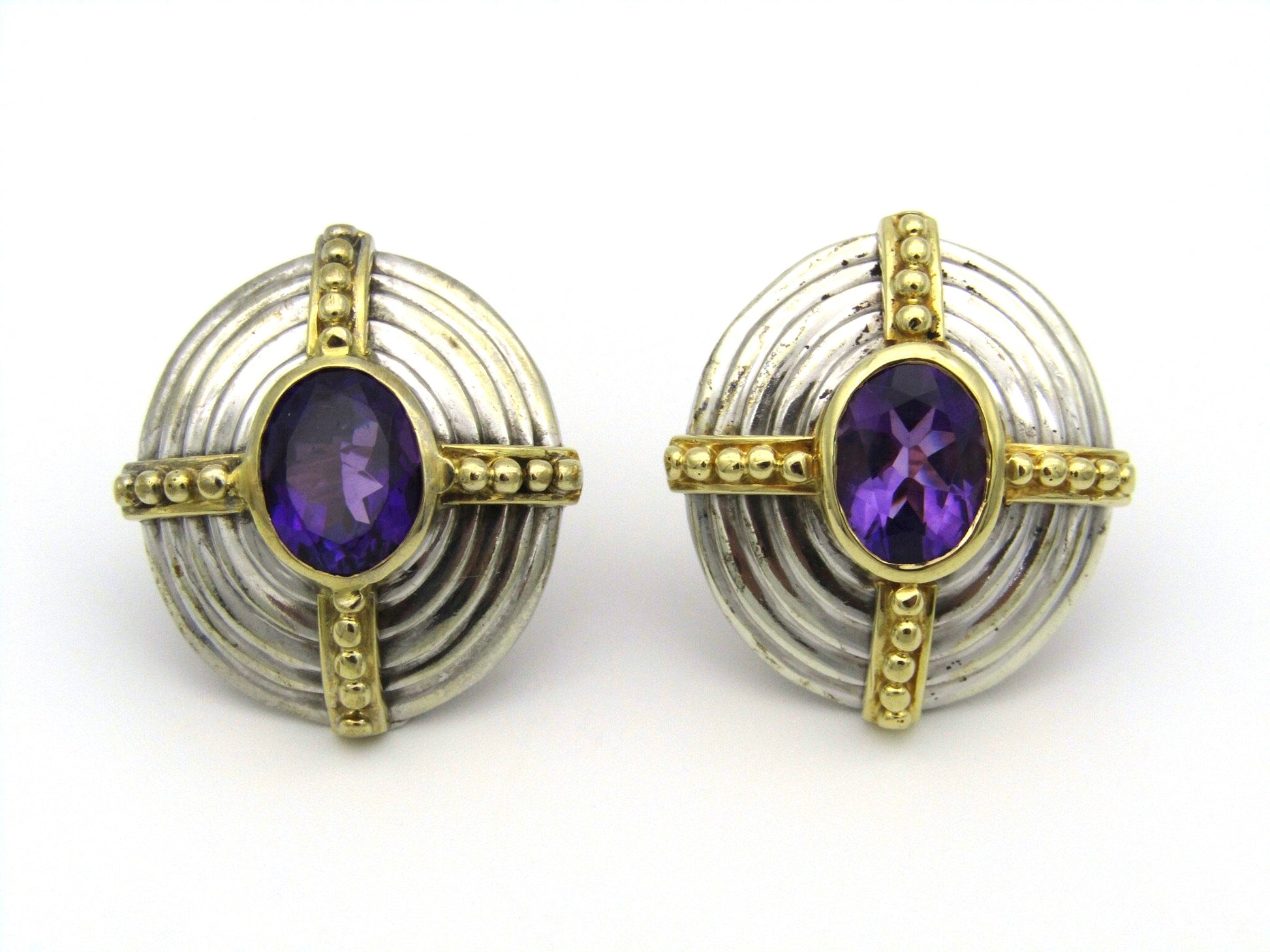 A pair of 18kt and 9kt gold amethyst earrings.