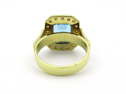 18kt yellow gold blue topaz and diamond ring.
