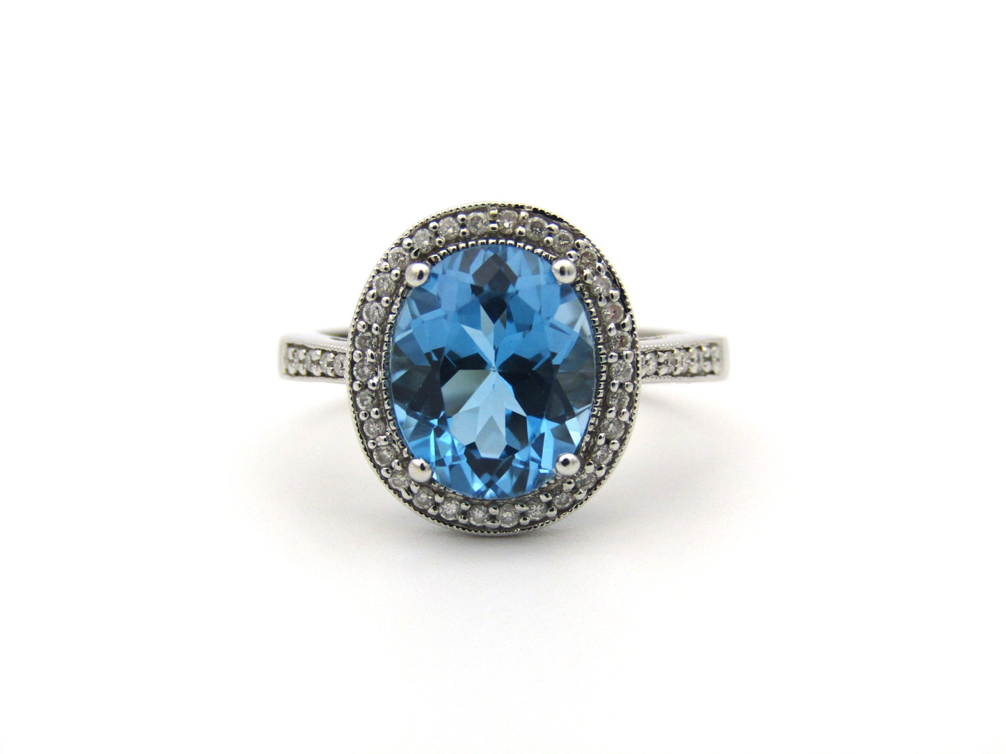 14K gold blue topaz and diamond ring.