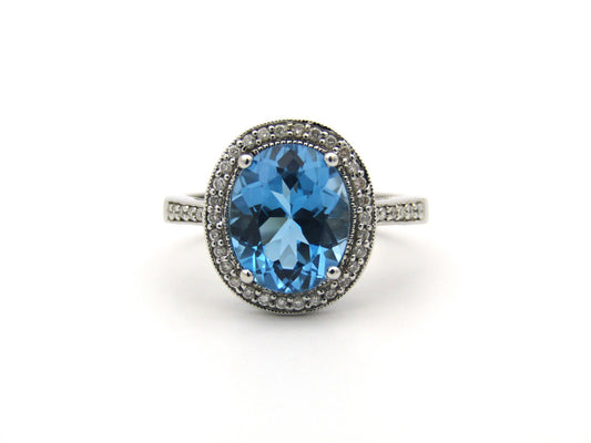 14K gold blue topaz and diamond ring.
