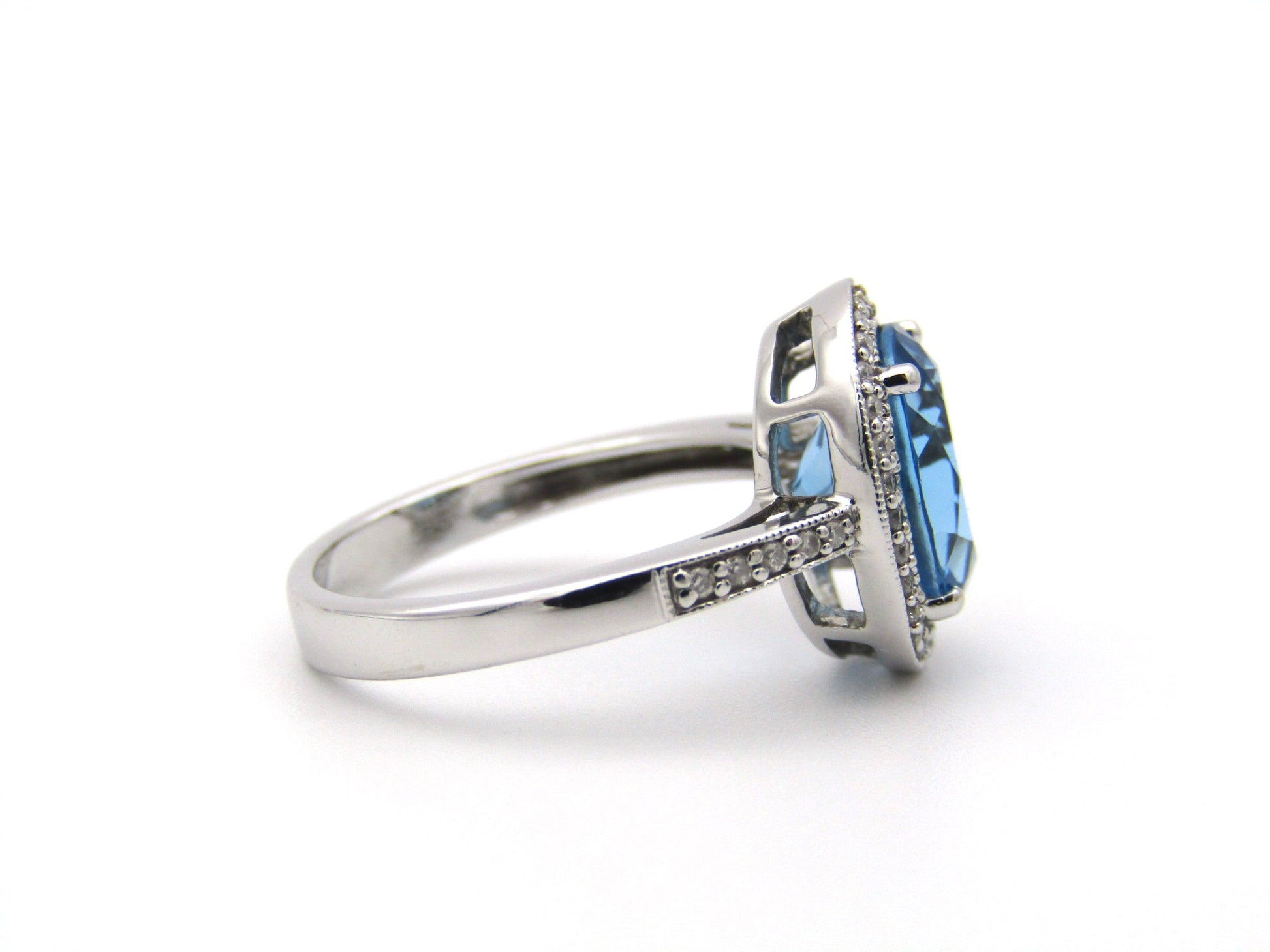 14K gold blue topaz and diamond ring.