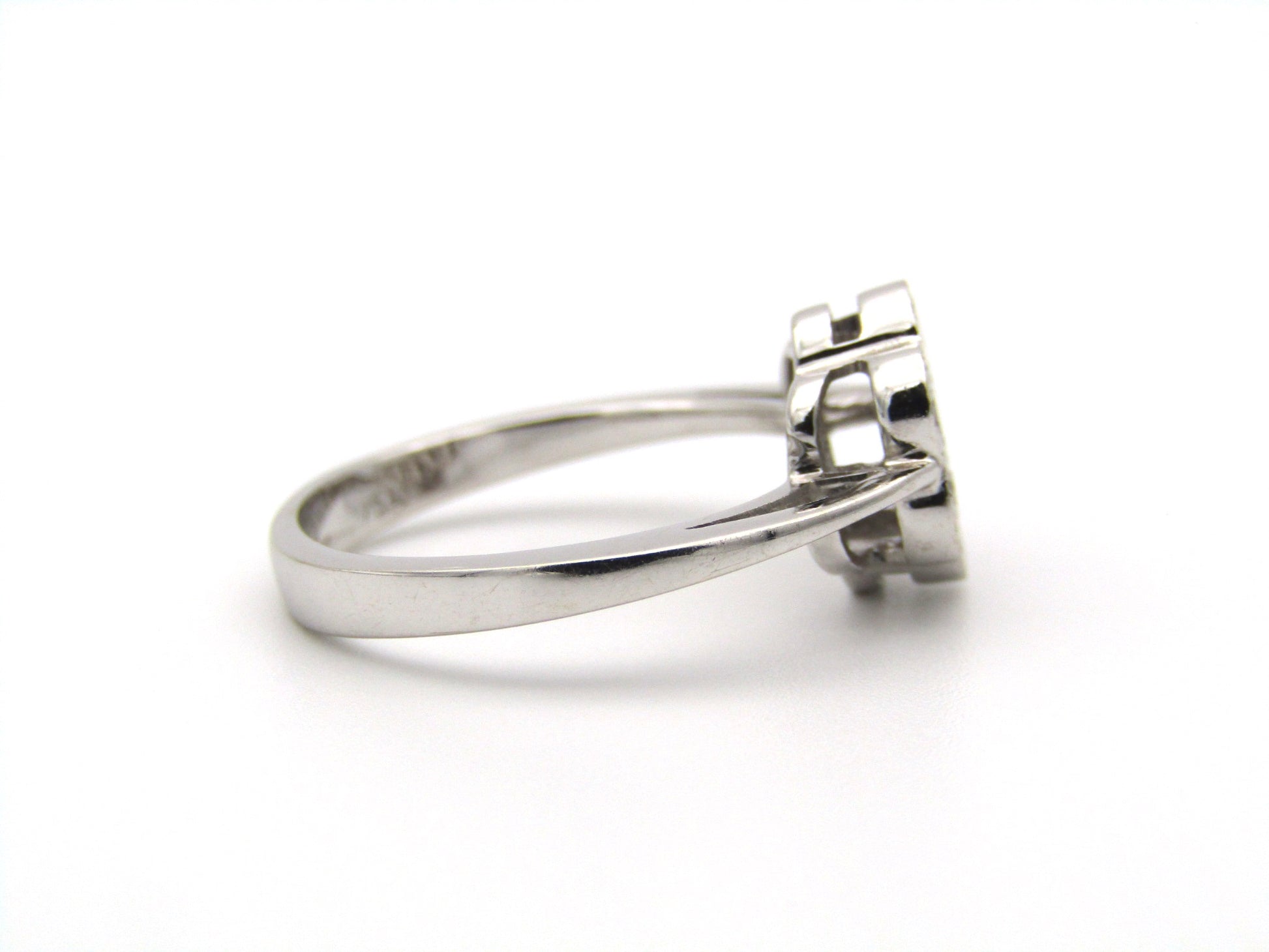 18K gold diamond flower ring.