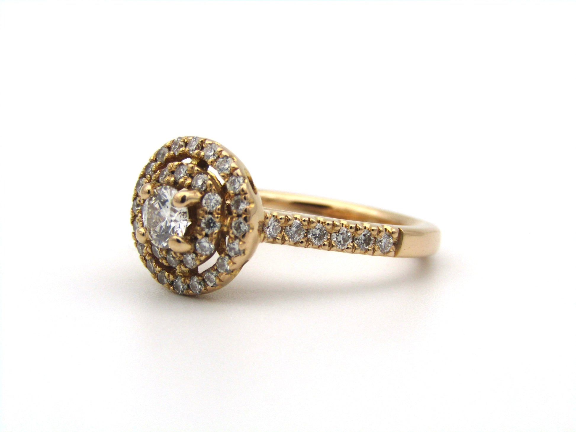 18K gold diamond halo ring.
