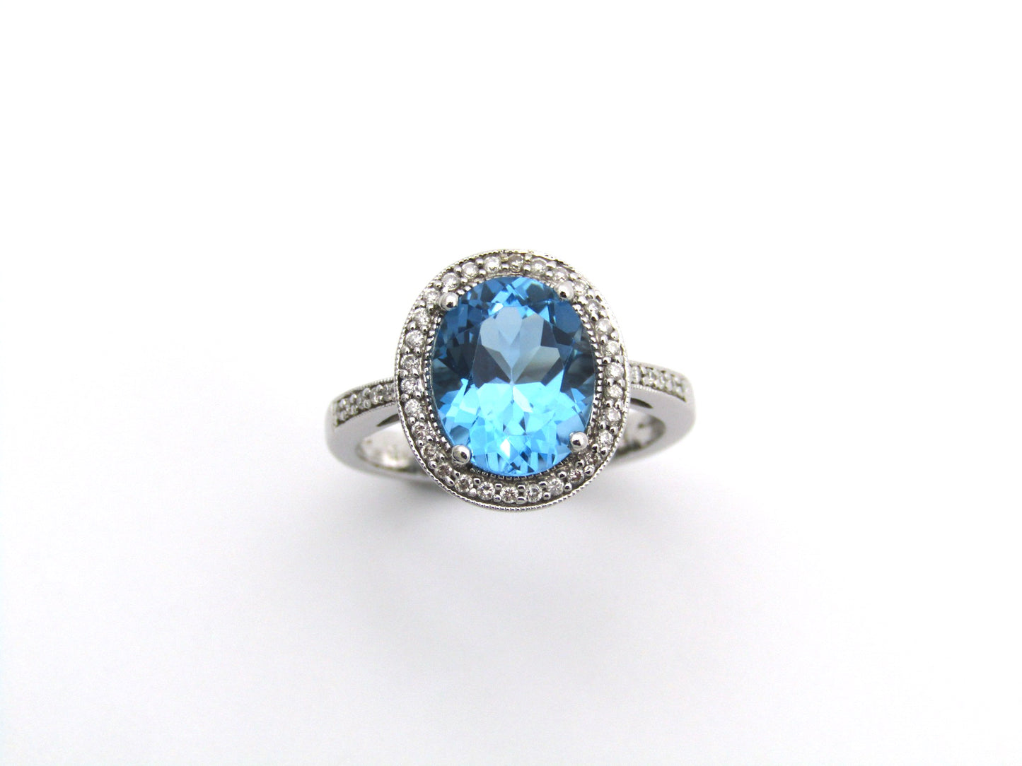 14K gold blue topaz and diamond ring.