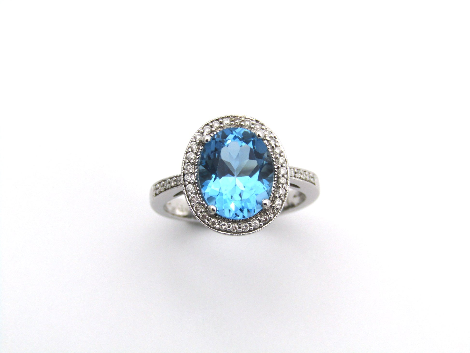 14K gold blue topaz and diamond ring.