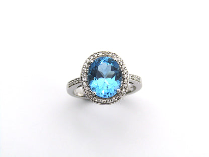 14K gold blue topaz and diamond ring.