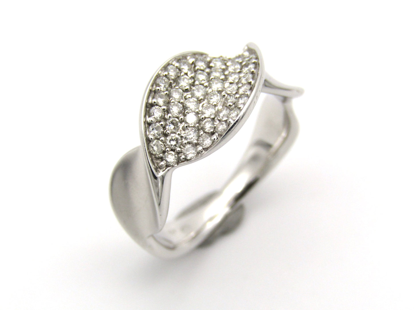 18K gold twist diamond ring.