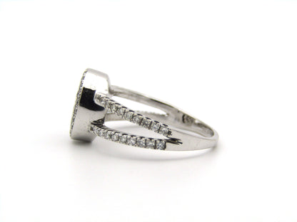 18K gold blue and colourless diamond ring.