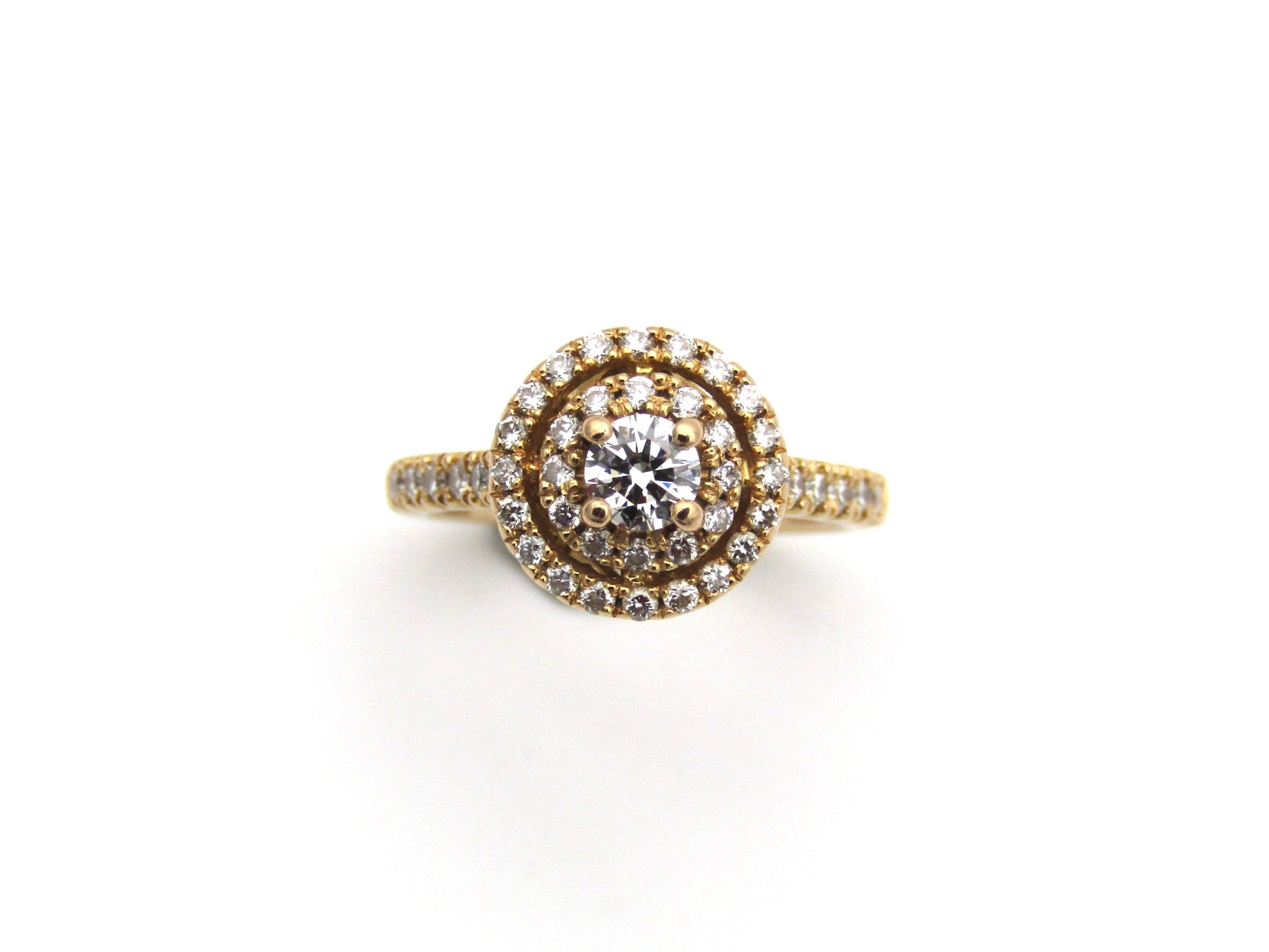 18K gold diamond halo ring.