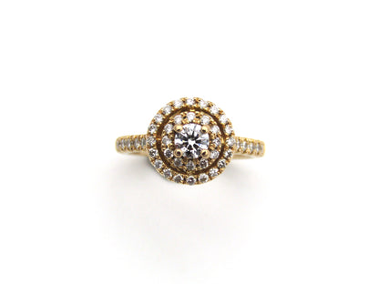18K gold diamond halo ring.