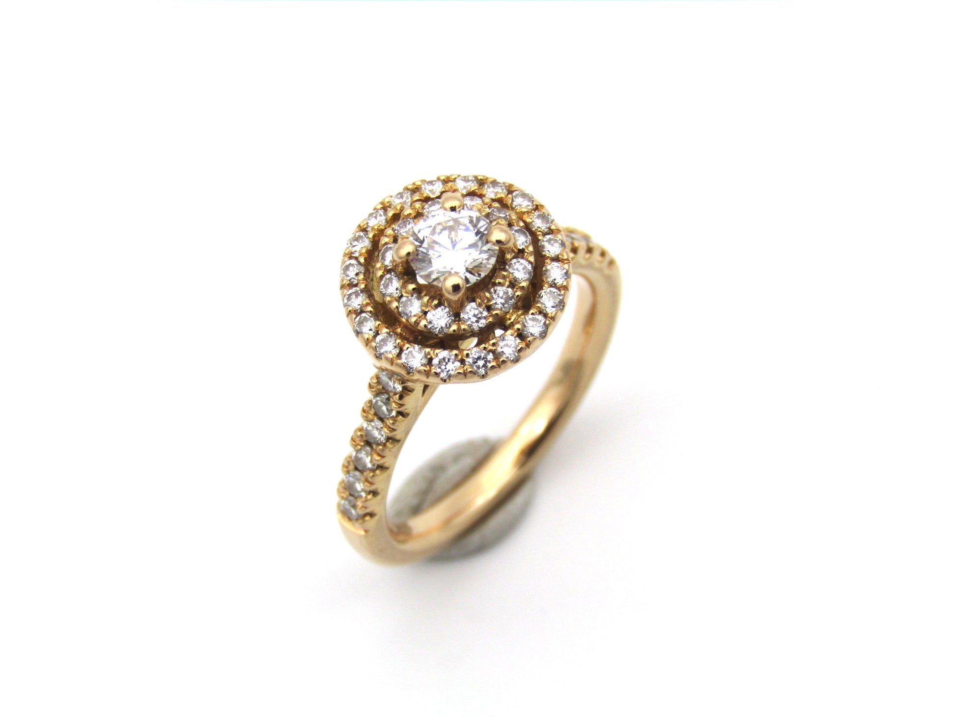 18K gold diamond halo ring.
