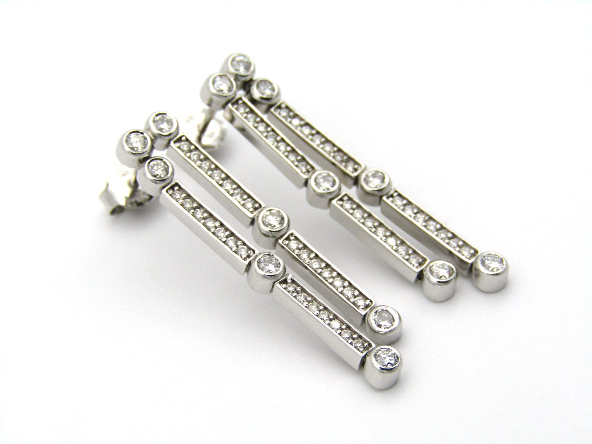 18K gold diamond drop earrings.