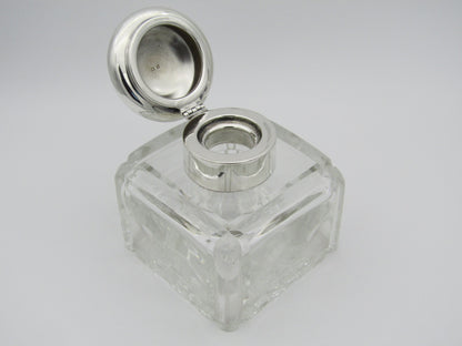 A silver mounted and cut glass desk inkwell by Asprey & Co. Ltd, Birmingham, 1915.