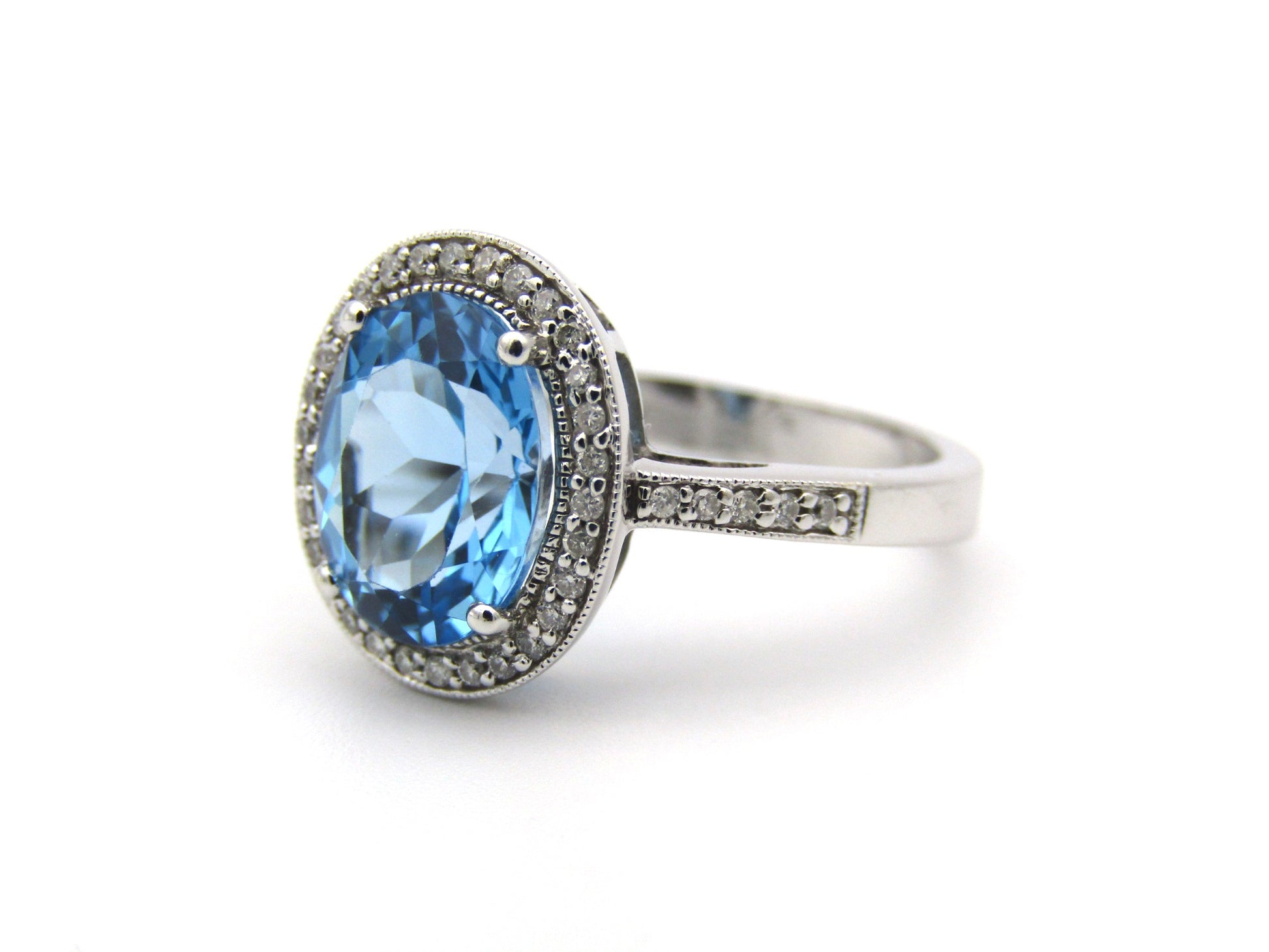 14K gold blue topaz and diamond ring.