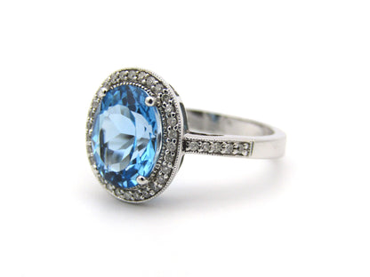 14K gold blue topaz and diamond ring.