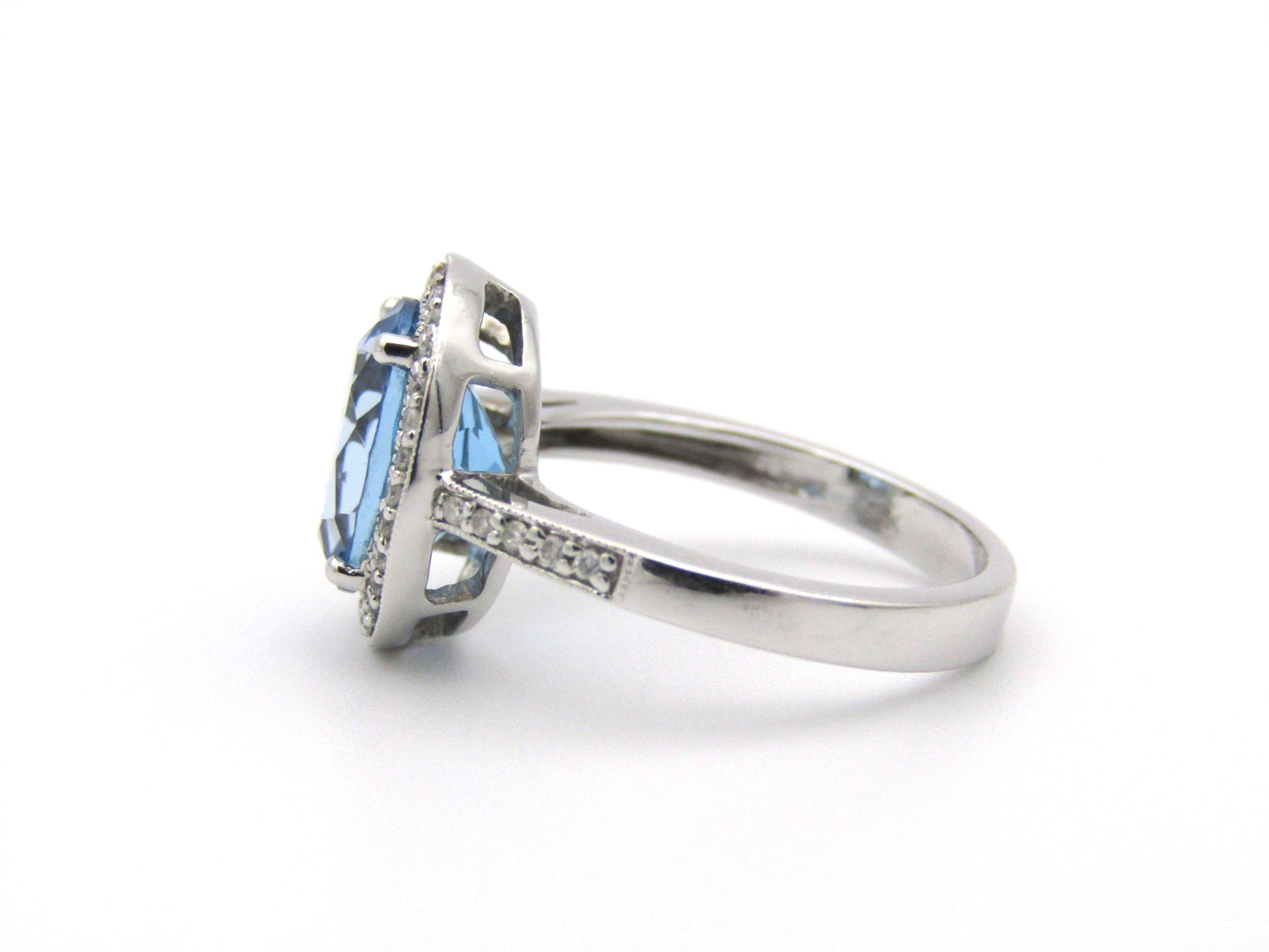 14K gold blue topaz and diamond ring.