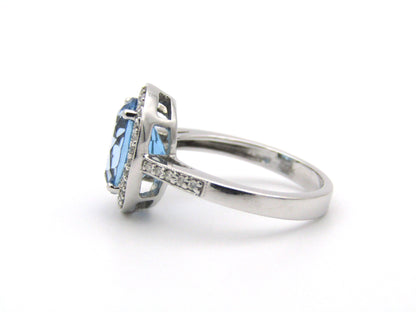 14K gold blue topaz and diamond ring.
