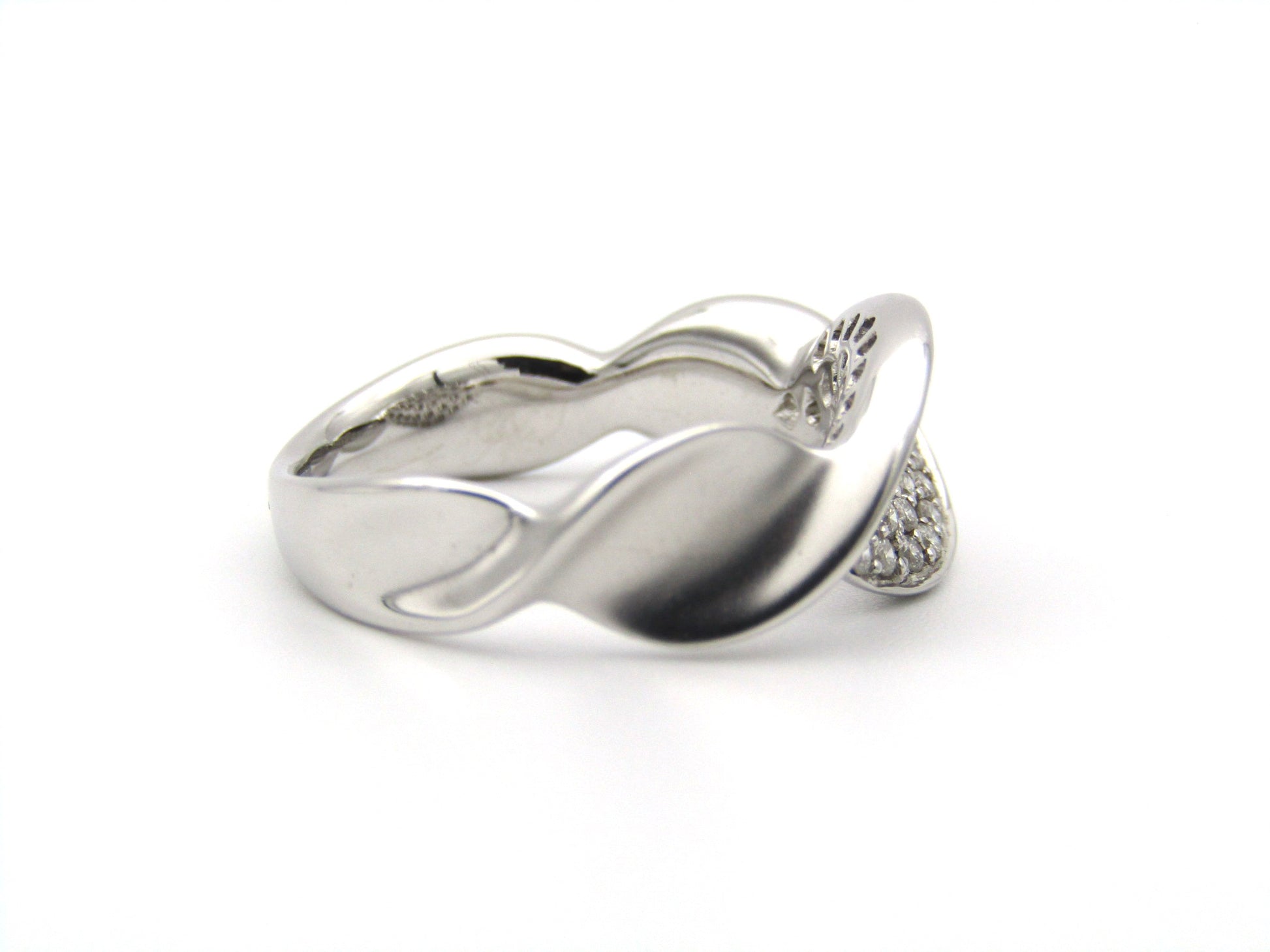18K gold twist diamond ring.