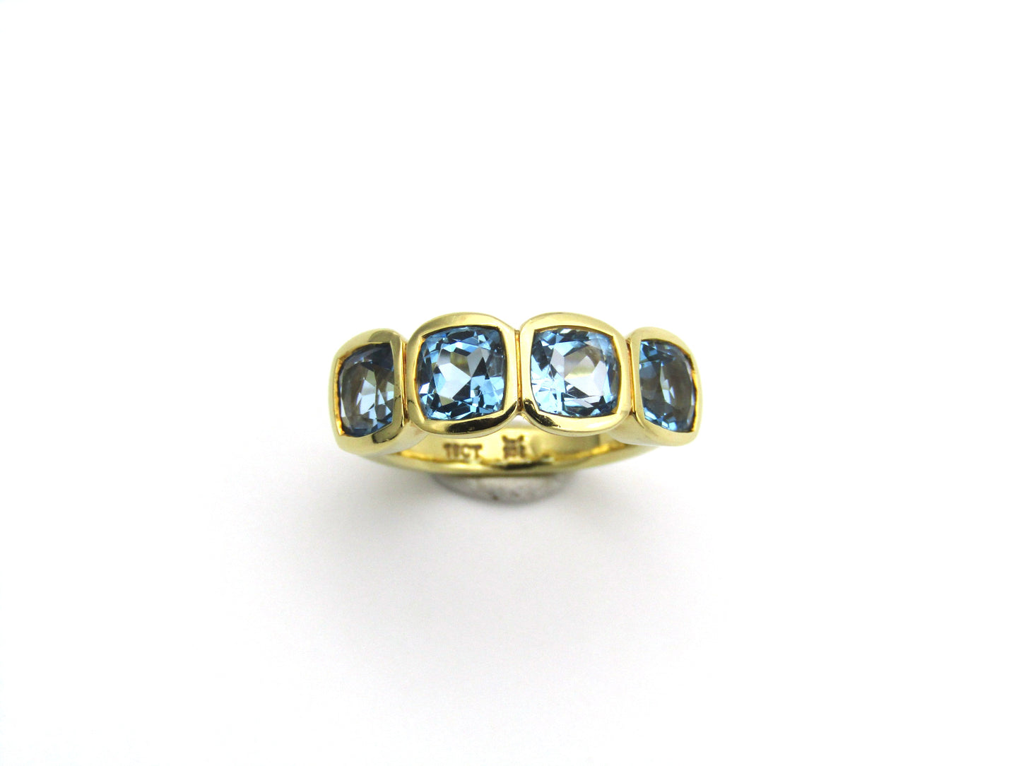 18K gold blue topaz ring.