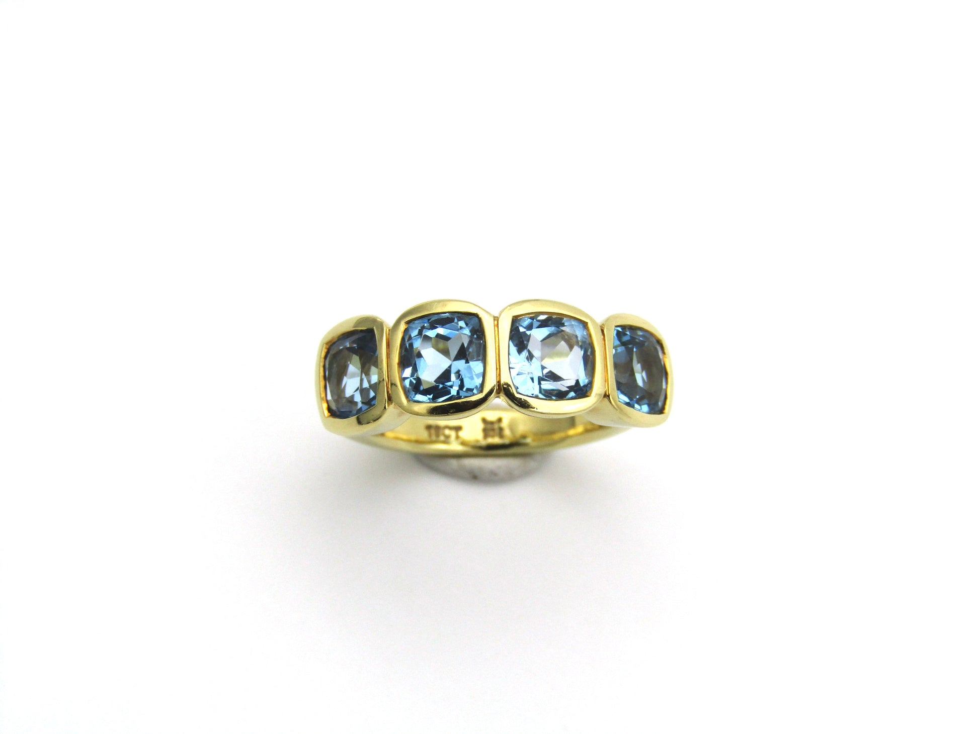 18K gold blue topaz ring.