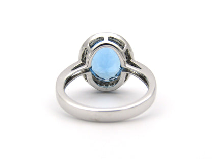 14K gold blue topaz and diamond ring.