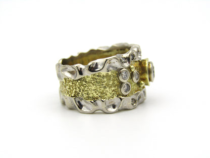 18kt gold diamond ring.