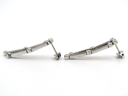 18K gold diamond drop earrings.