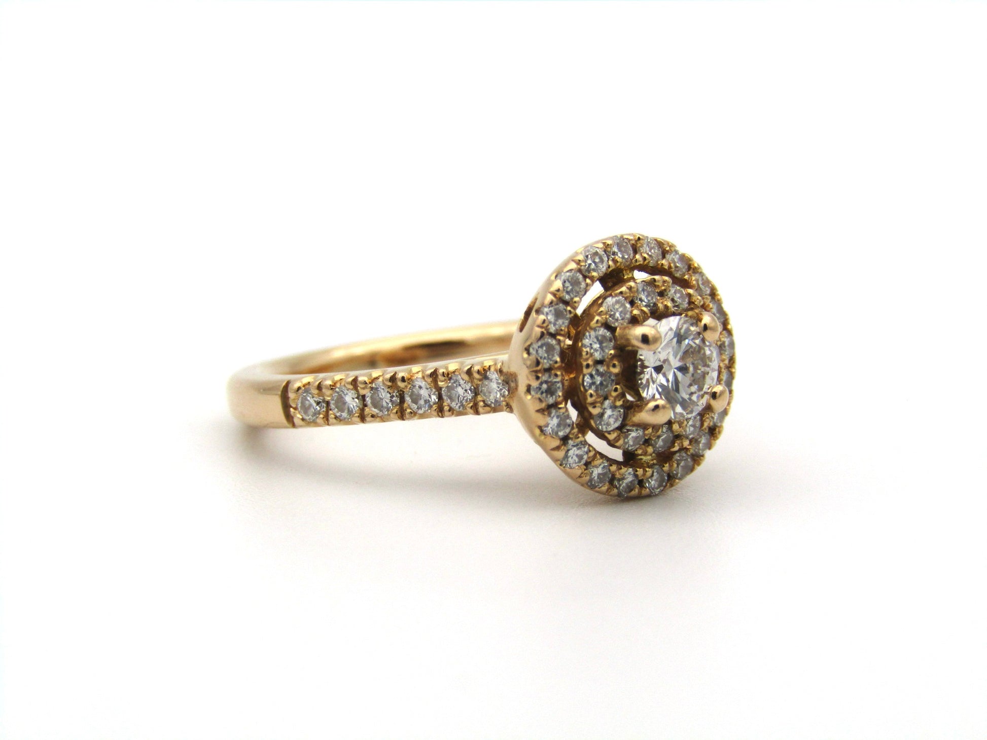 18K gold diamond halo ring.