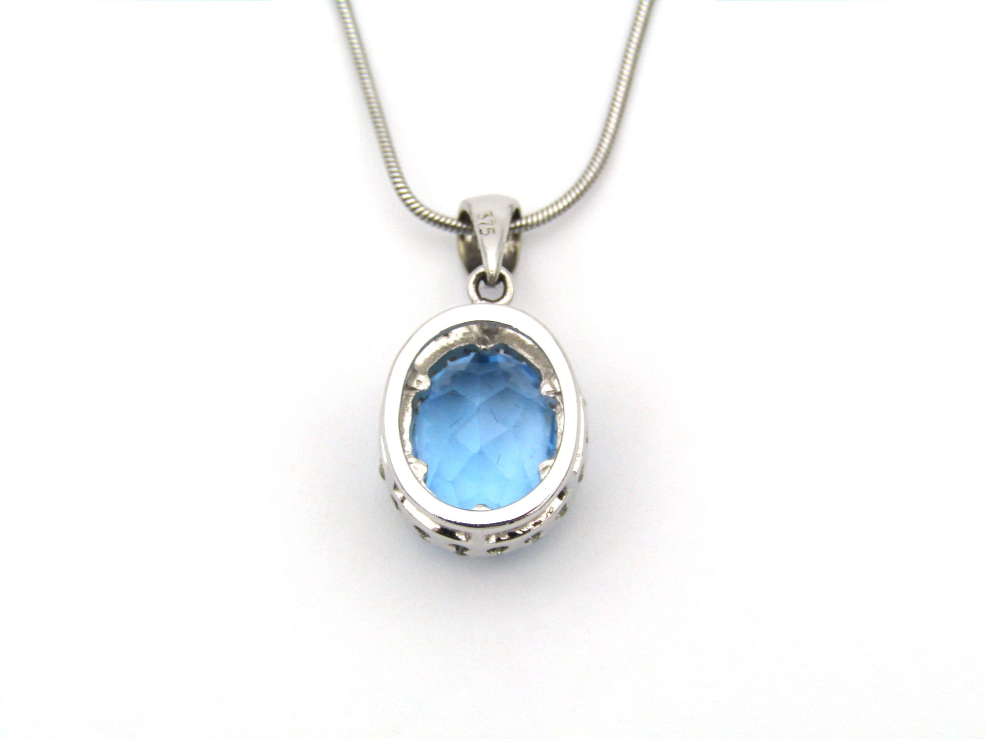 9K gold blue topaz and diamond pendant.