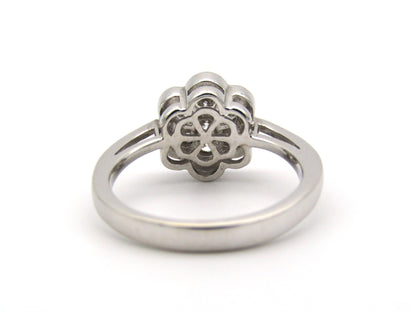 18K gold diamond flower ring.