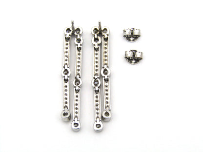 18K gold diamond drop earrings.