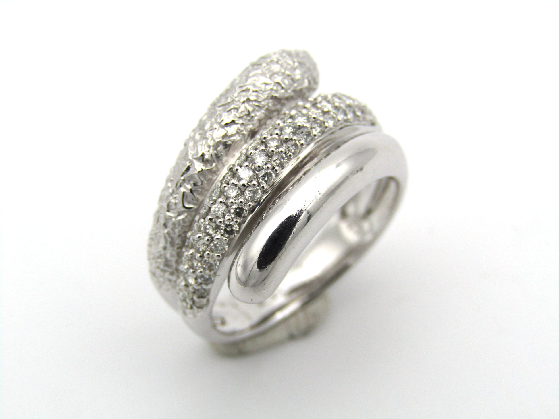 9K gold diamond twist ring.