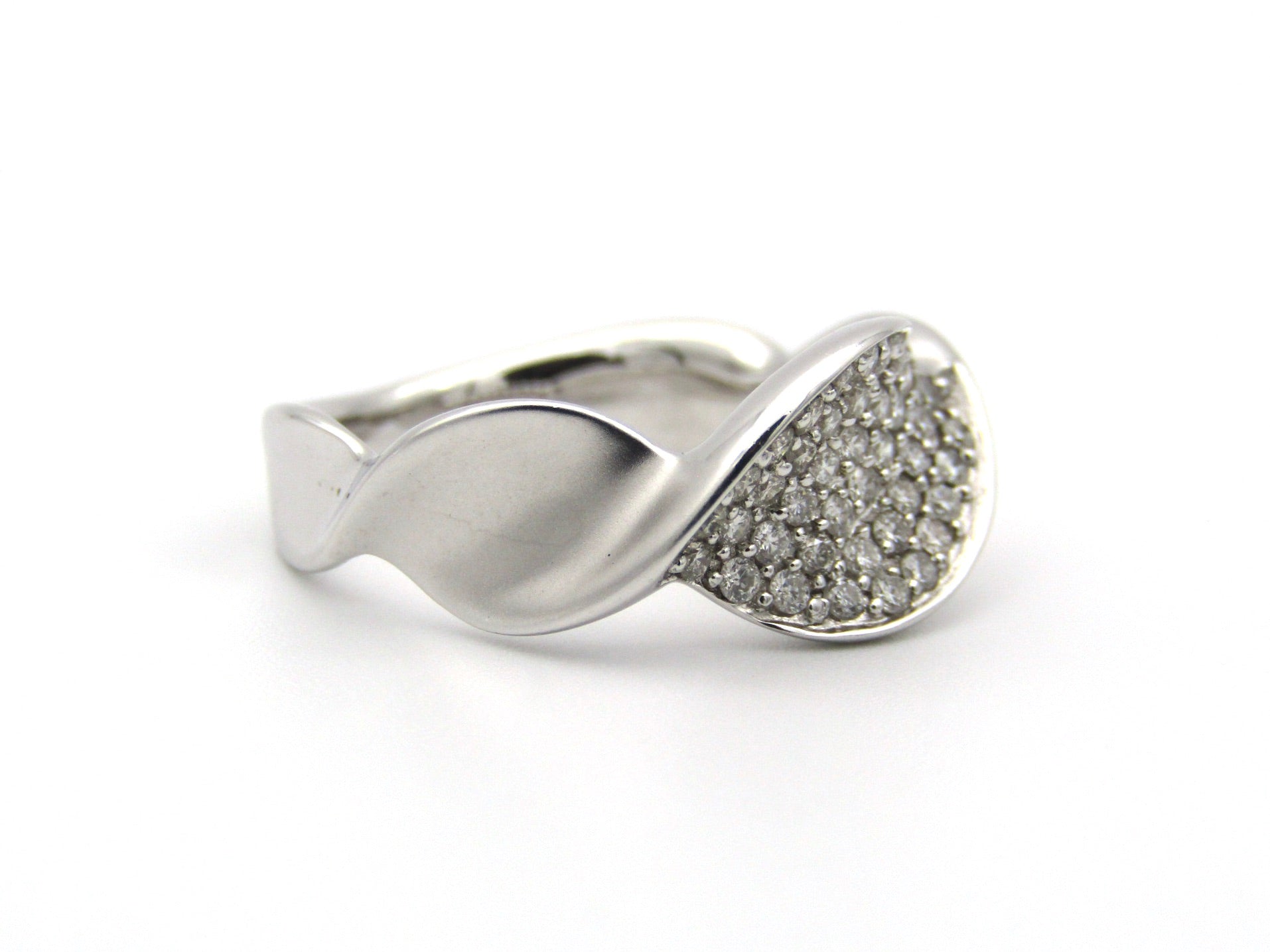 18K gold twist diamond ring.