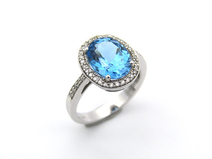 14K gold blue topaz and diamond ring.