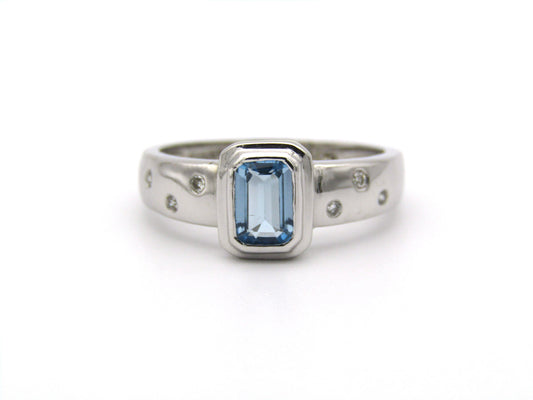 9K gold blue topaz and diamond ring by Browns.