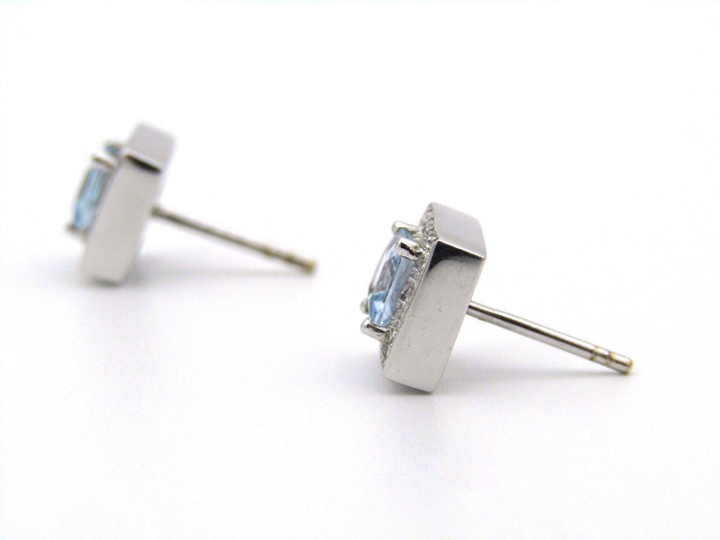 A pair of 18kt gold Blue Topaz and diamond earrings.