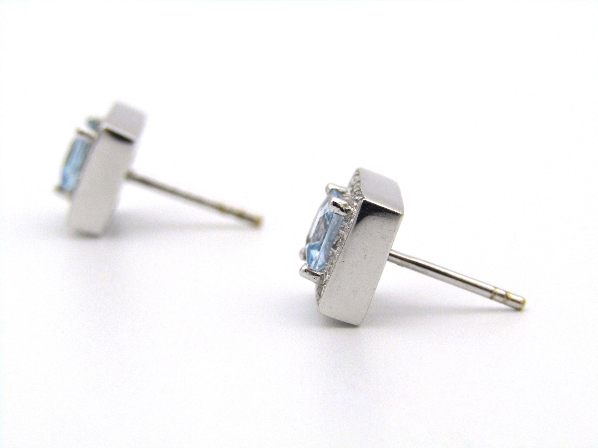 A pair of 18kt gold Blue Topaz and diamond earrings.