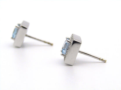 A pair of 18kt gold Blue Topaz and diamond earrings.