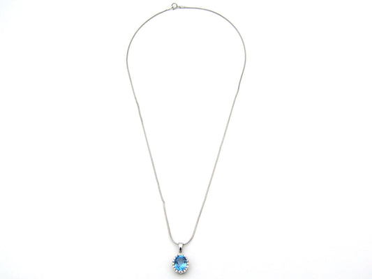 9K gold blue topaz and diamond pendant.
