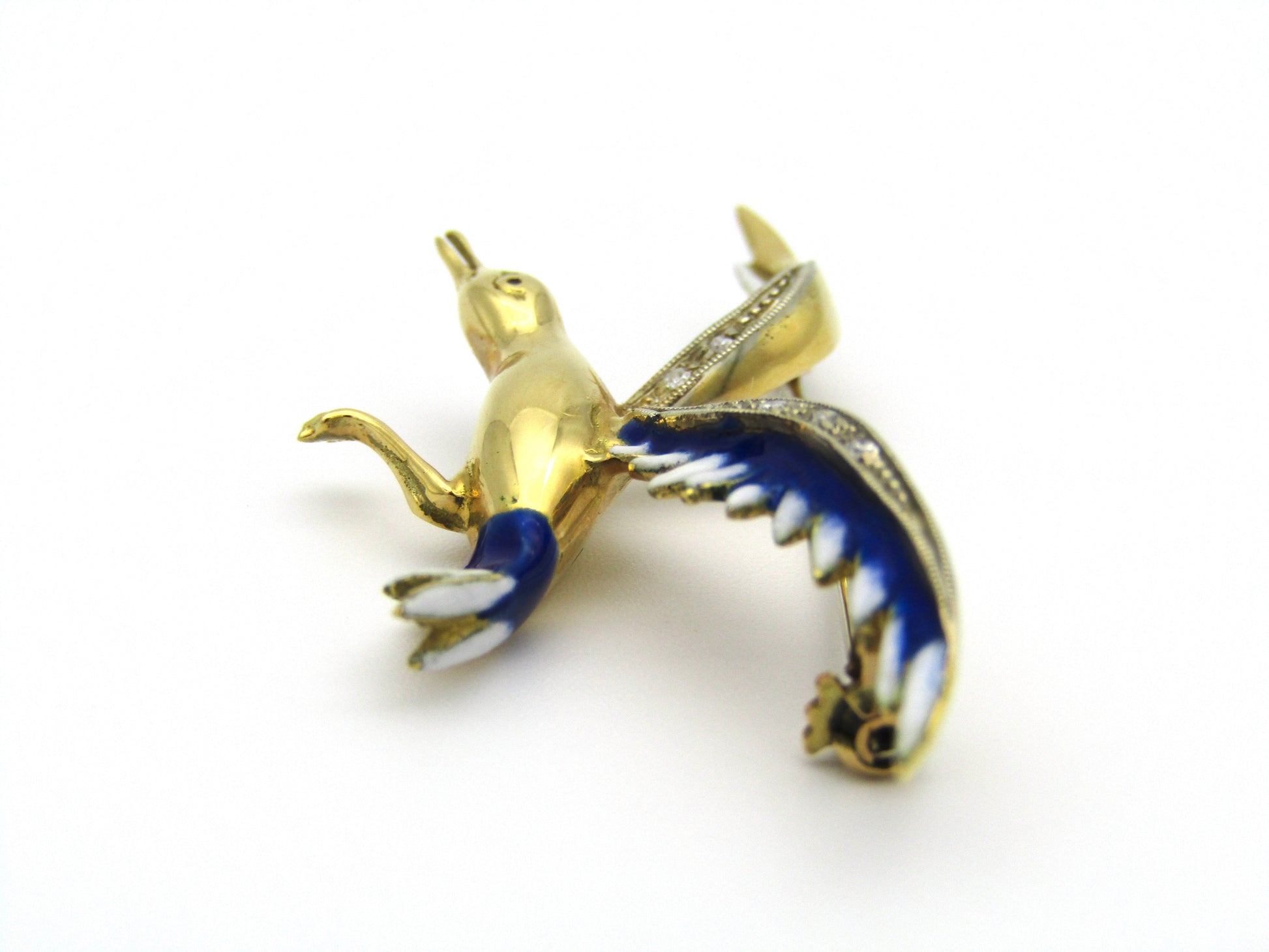 18kt gold diamond and enamel "Bird in flight" brooch.
