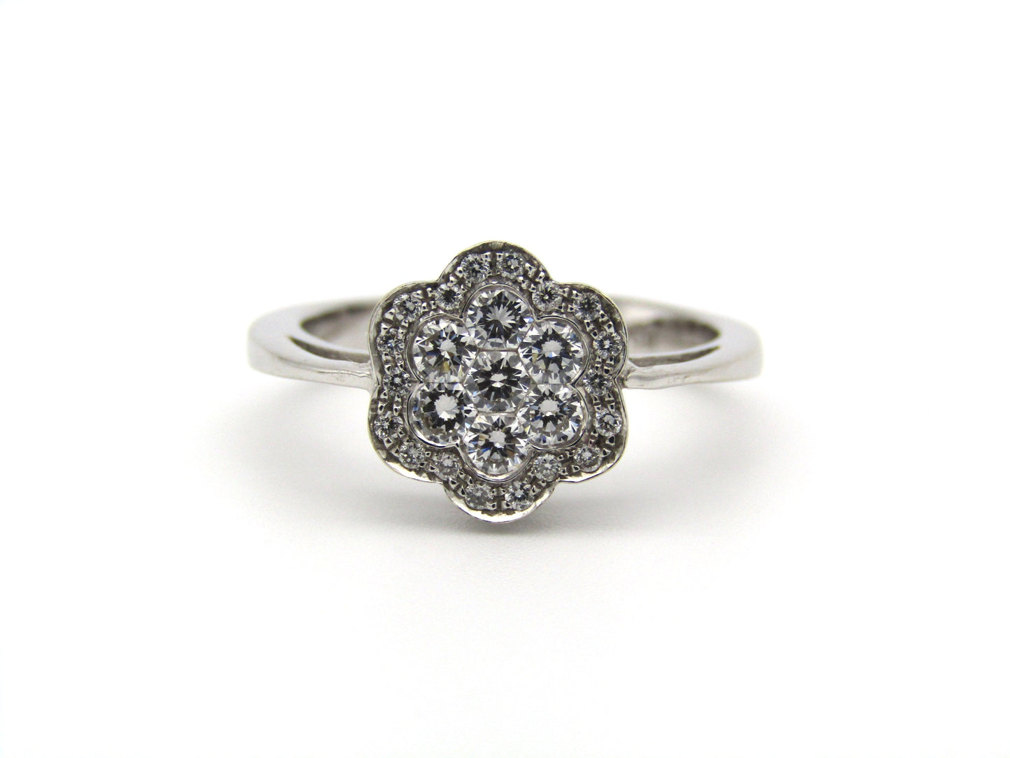 18K gold diamond flower ring.