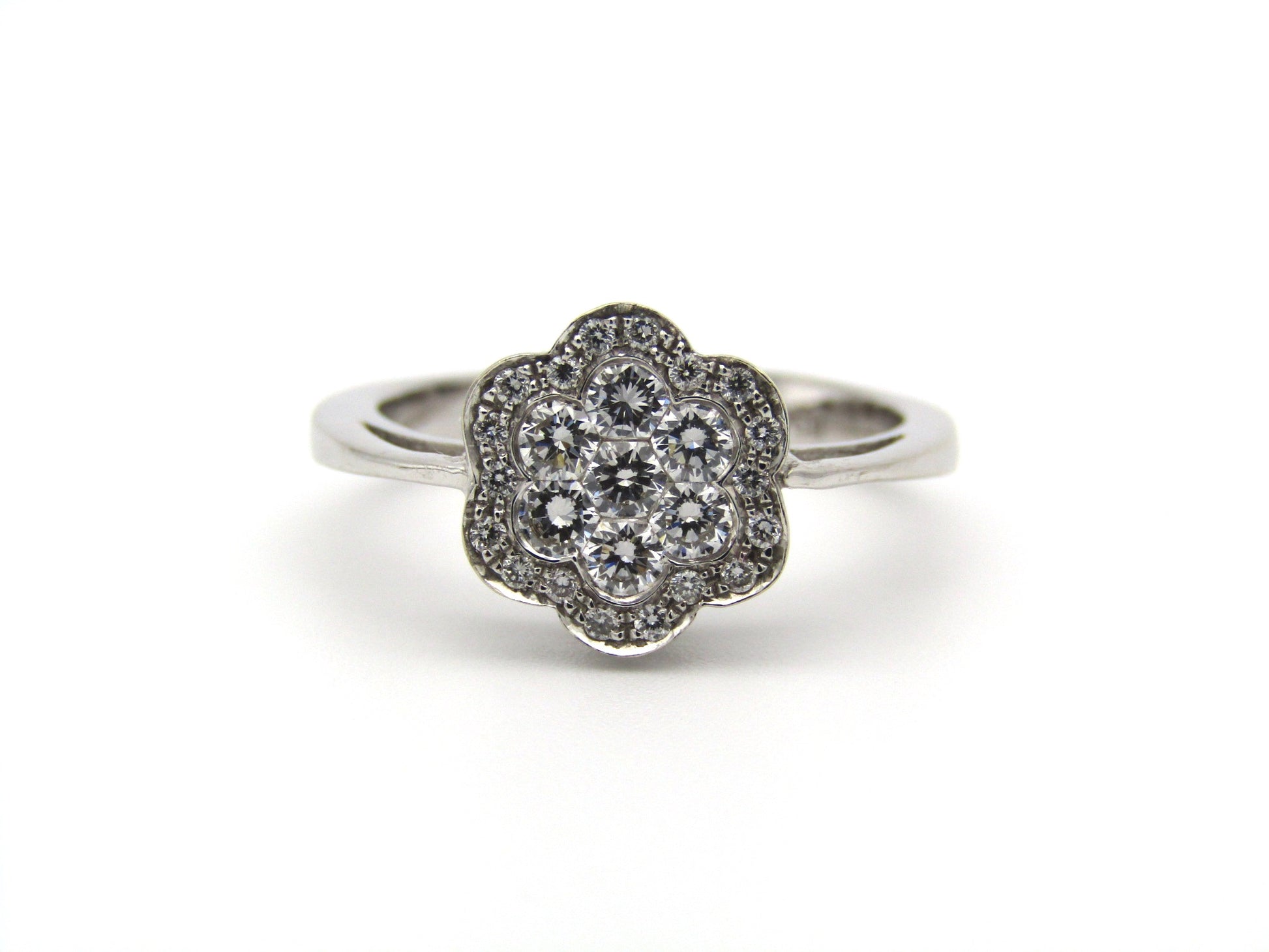 18K gold diamond flower ring.