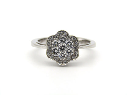 18K gold diamond flower ring.