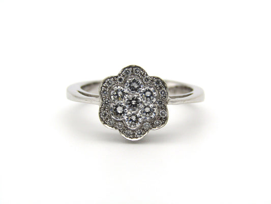 18K gold diamond flower ring.