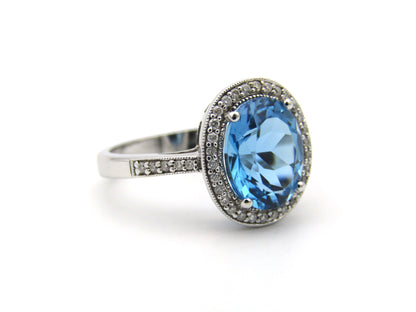 14K gold blue topaz and diamond ring.