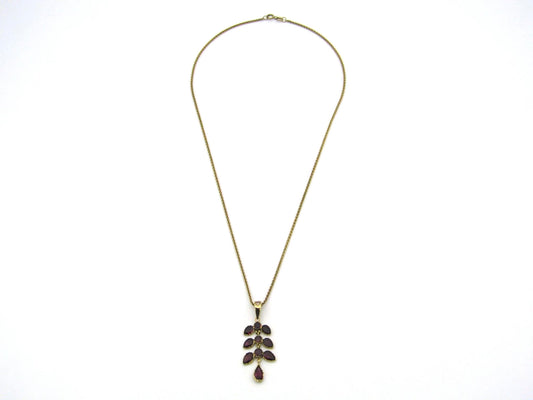 A Vintage 9K gold Almandine garnet and diamond pendant.