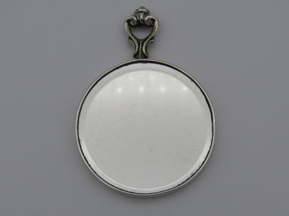 A sterling silver hand mirror by Cartier. Circa 1920s.