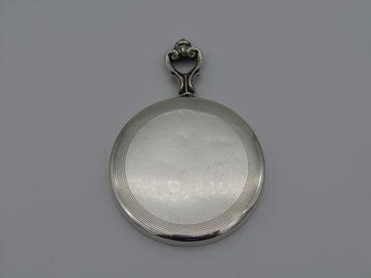 A sterling silver hand mirror by Cartier. Circa 1920s.